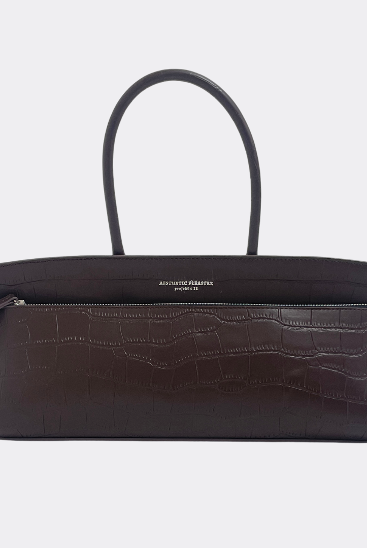 Dark brown baguette handbag with crocodile texture by Aesthetic Pleasure on a white background