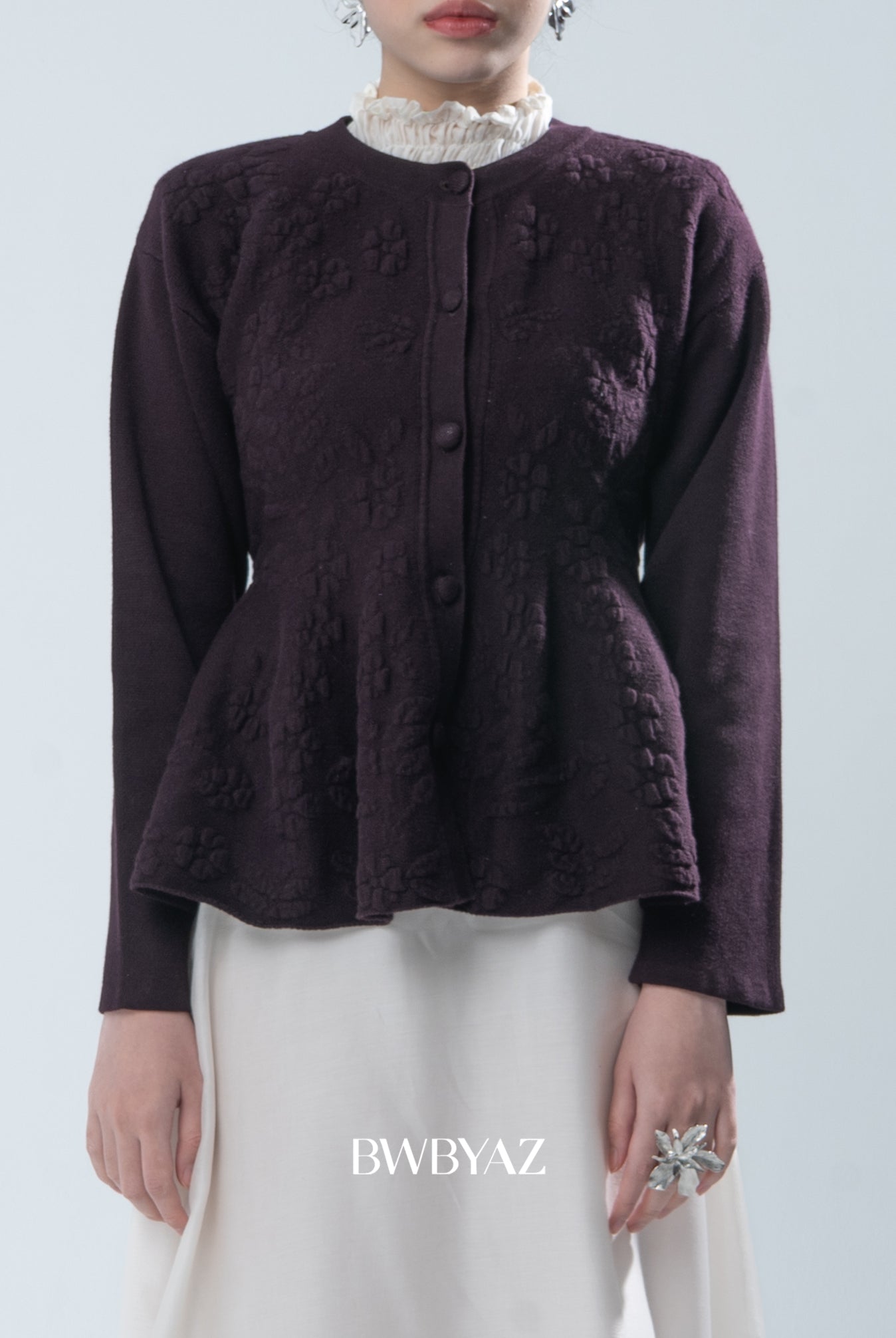 Dark purple textured jacket worn by a person on a light gray background, with 'BWBYAZ' branding.