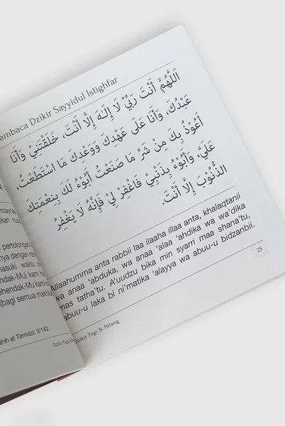 Open book with Arabic text on a white background