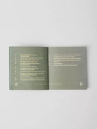 Open book with text on a light gray background