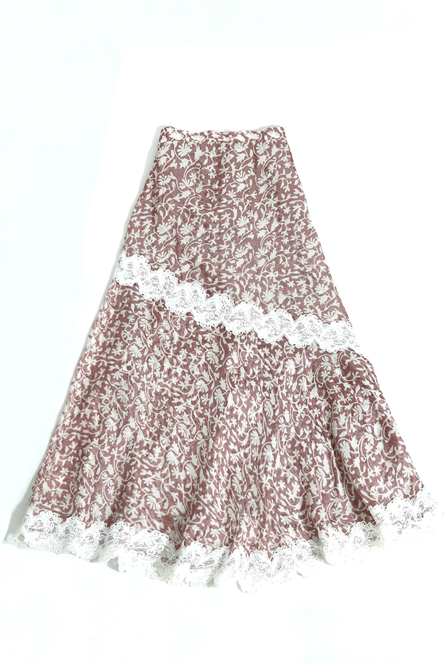 Long asymmetric skirt by Kartinis Label with mermaid silhouette cut, lace details, and side opening with zipper.