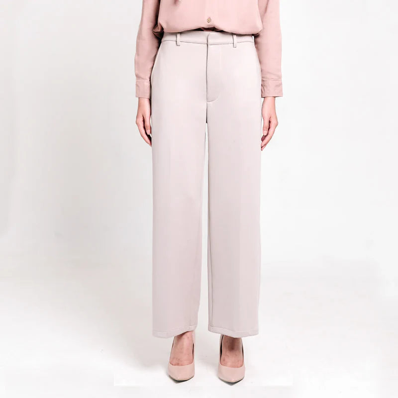 Person wearing light pink shirts and light grey culotte pants from Atala Scarves on a white background