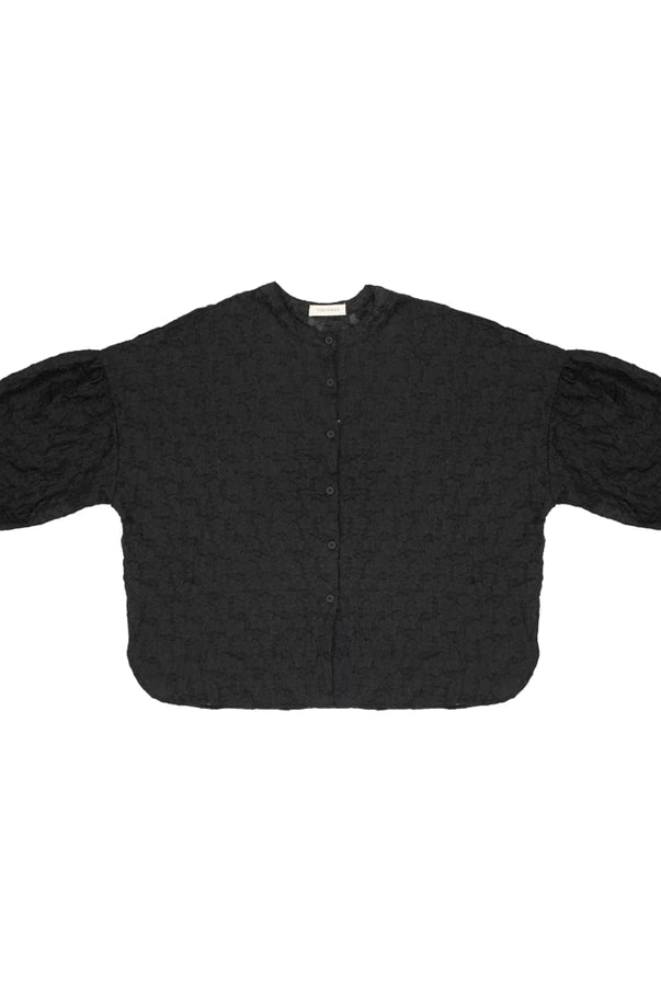 A black textured short-sleeve shirt by Yestoday with puffed balloon sleeves and a button-up front, laid flat on a white background.