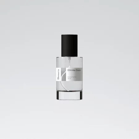 A bottle of Ellinka Doors perfume with a white label and black cap from Boura against a white background.