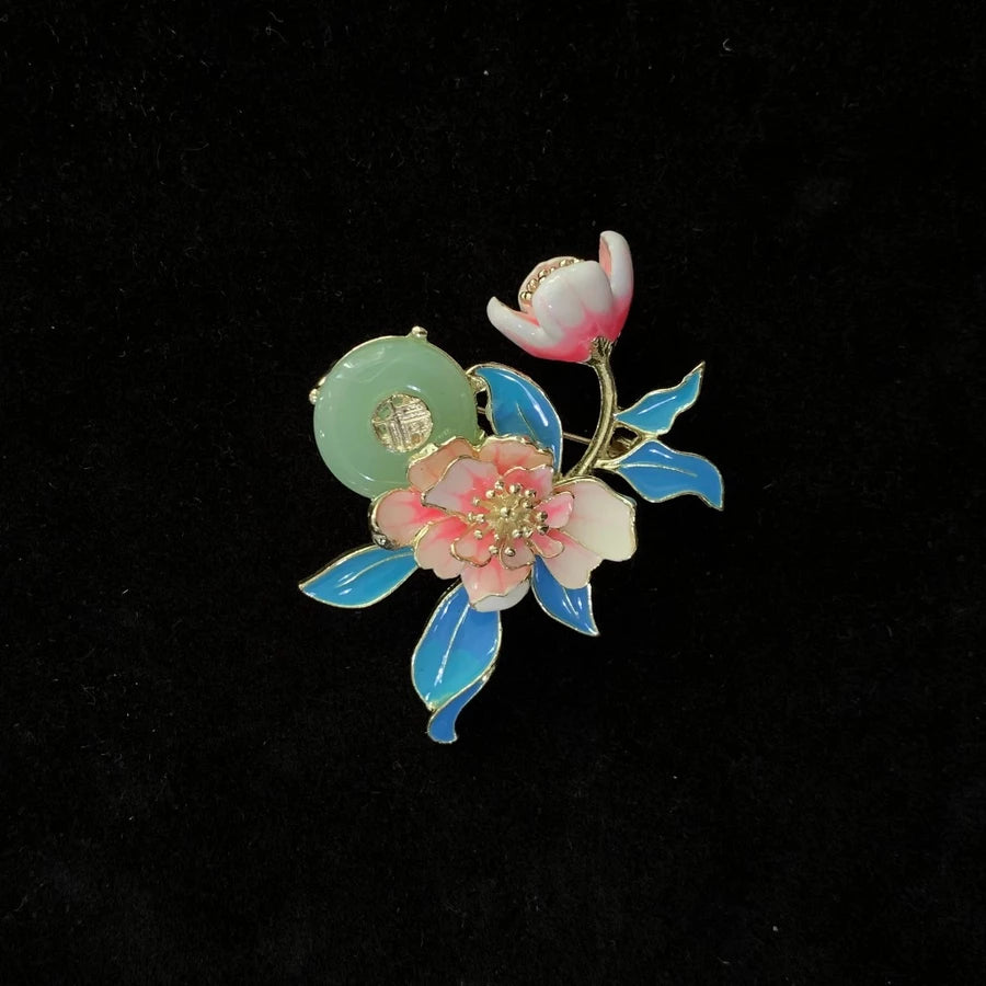 Floral brooch with pink and blue flowers by Holypeony on a black background