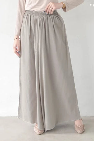 Person wearing a long light gray pants by Mistyvori on a plain background