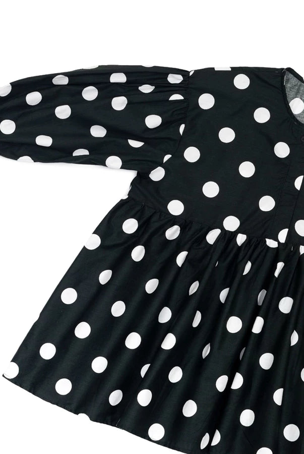 Black dress with white polka dots by Yestoday on a white background