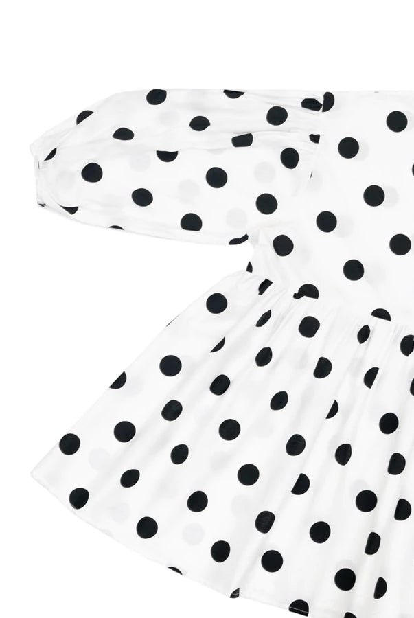 White dress with black polka dots by Yestoday on a white background