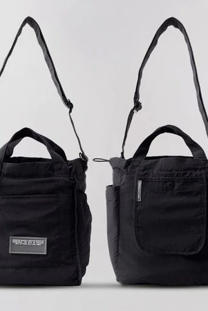 Reversible mini tote bag in black from Muhajir Project on a white background