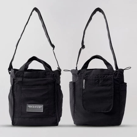 Reversible mini tote bag in black from Muhajir Project on a white background