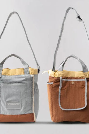 Reversible mini tote bag with different color combinations from Muhajir Project on a white background