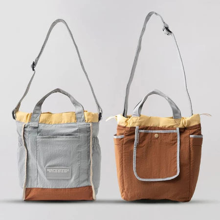 Reversible mini tote bag with different color combinations from Muhajir Project on a white background