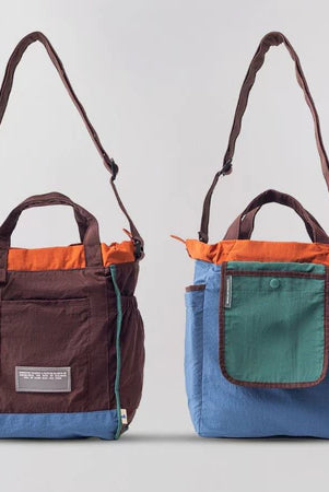 Reversible mini tote bag with different color combinations from Muhajir Project on a white background