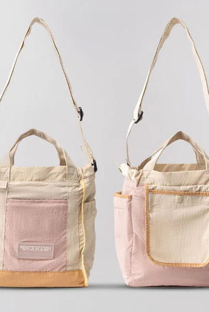 Reversible mini tote bag with different color combinations from Muhajir Project on a white background