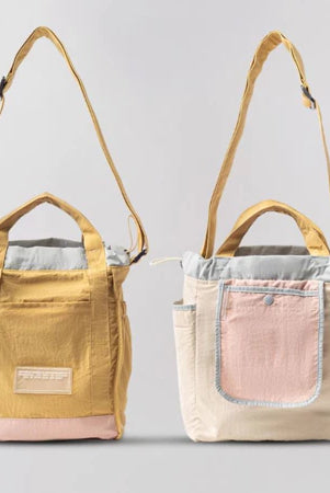 Reversible mini tote bag with different color combinations from Muhajir Project on a white background