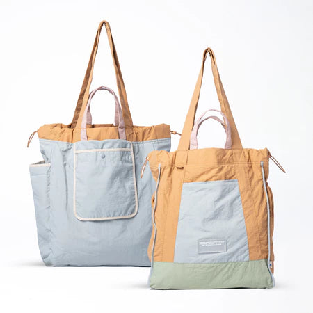 Reversible tote bag with different color combinations from Muhajir Project on a white background