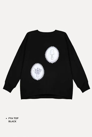 Black t-shirt by Maima with white designs on a light gray background