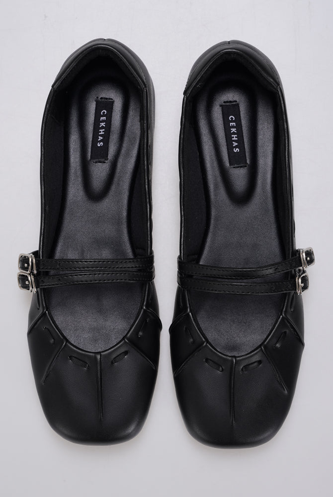 Black Mary Jane flatshoes by Cekhas with double buckle straps and square toe design.