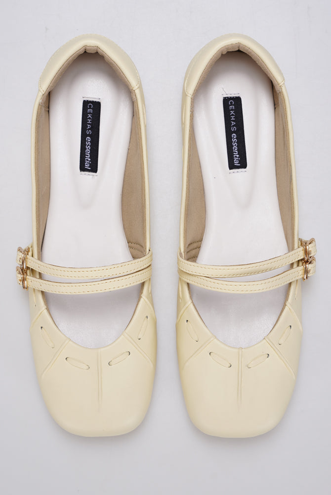 Butter Yellow Mary Jane flatshoes by Cekhas with double buckle straps and square toe design.
