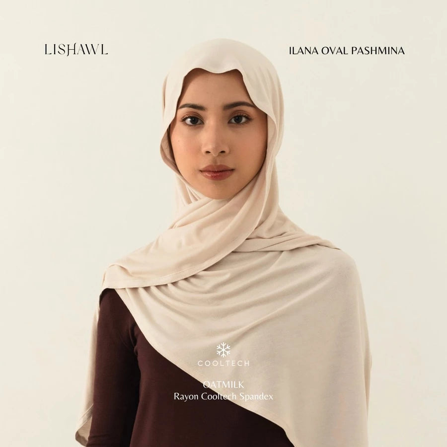 Woman wearing a light brown Lishawl Ilana Oval Pashmina by BWBYAZ on a plain background