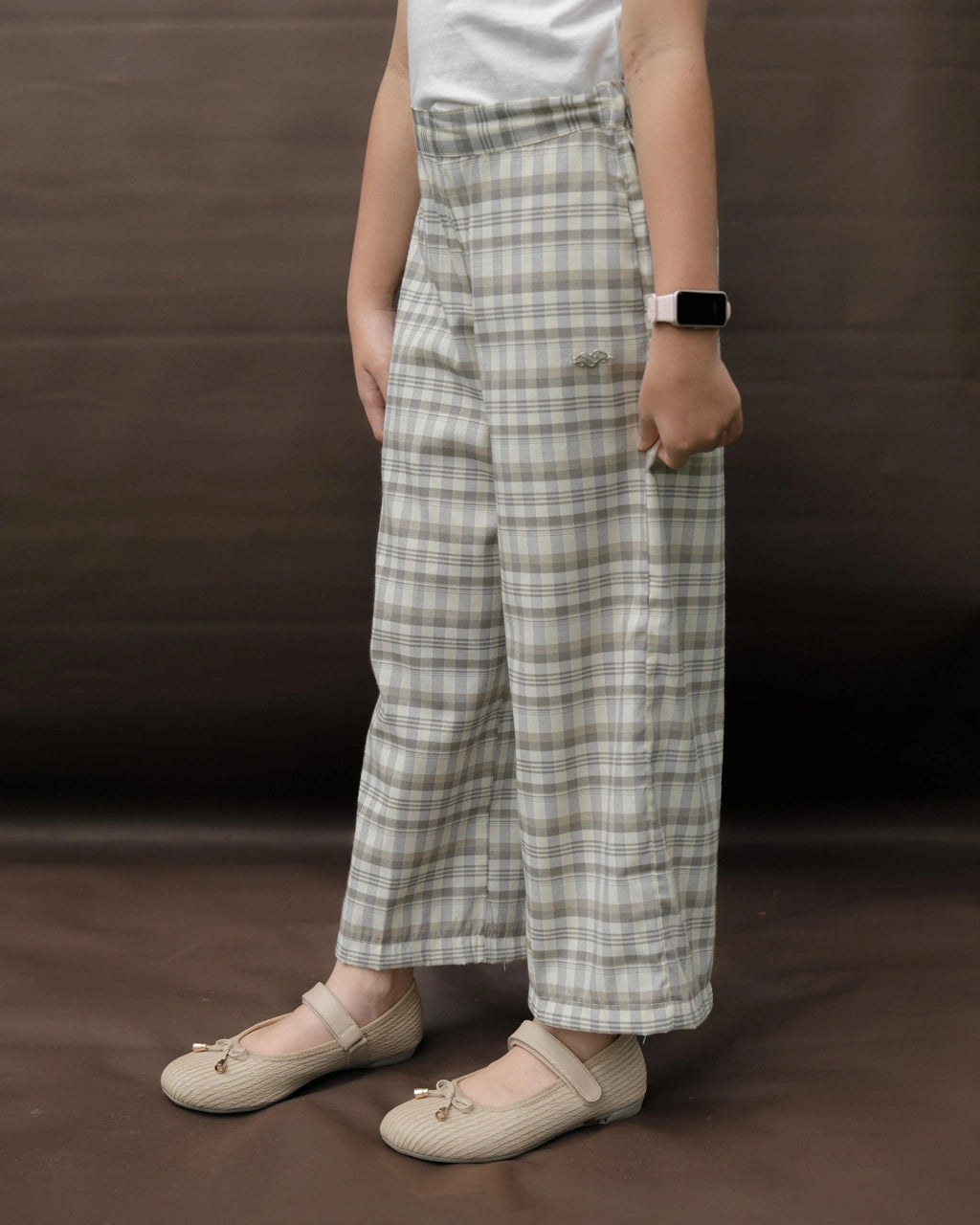 Person wearing plaid pants by Mistyvori on a brown background
