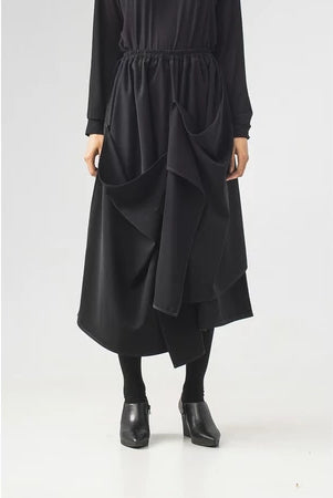 Black midi skirt with layered design by Rashawl on a white background