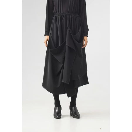 Black midi skirt with layered design by Rashawl on a white background