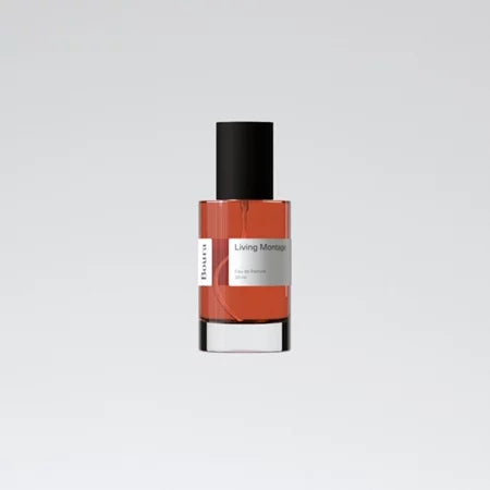 A bottle of Boura Living Montage perfume with a clear liquid visible inside, having a black cap and a white label.