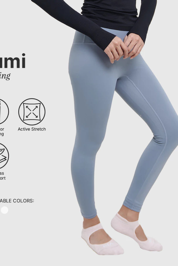 Light blue leggings by HIA worn by a person on a white background with product features listed.
