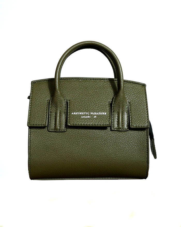 A small olive green grain leather handbag with a logo stamp in front and a tubular handle, made from cow leather by Aesthetic Pleasure.