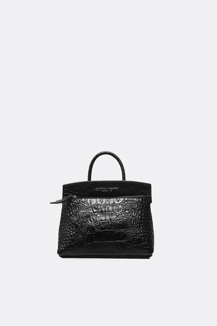 Black crocodile skin ace handbag by Aesthetic Pleasure on a white background