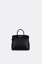 Black grain leather mini handbag by Aesthetic Pleasure on a light gray background