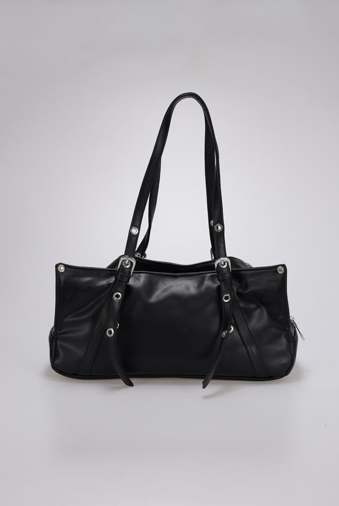 A black leather shoulder bag by Cekhas with silver-tone hardware, shown against a neutral light gray background.