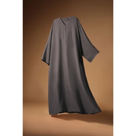 Gray Mecca Dhurma Abaya by Nehhat Modest on a brown background