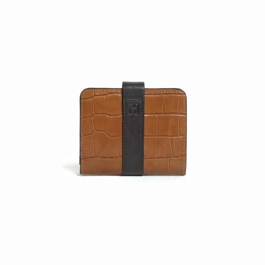 A closed brown bifold wallet from purotti with a textured surface, displayed against a solid background.