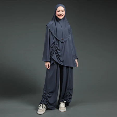 Person wearing a navy blue hijab activewear set by Lozy Hijab on a gray background