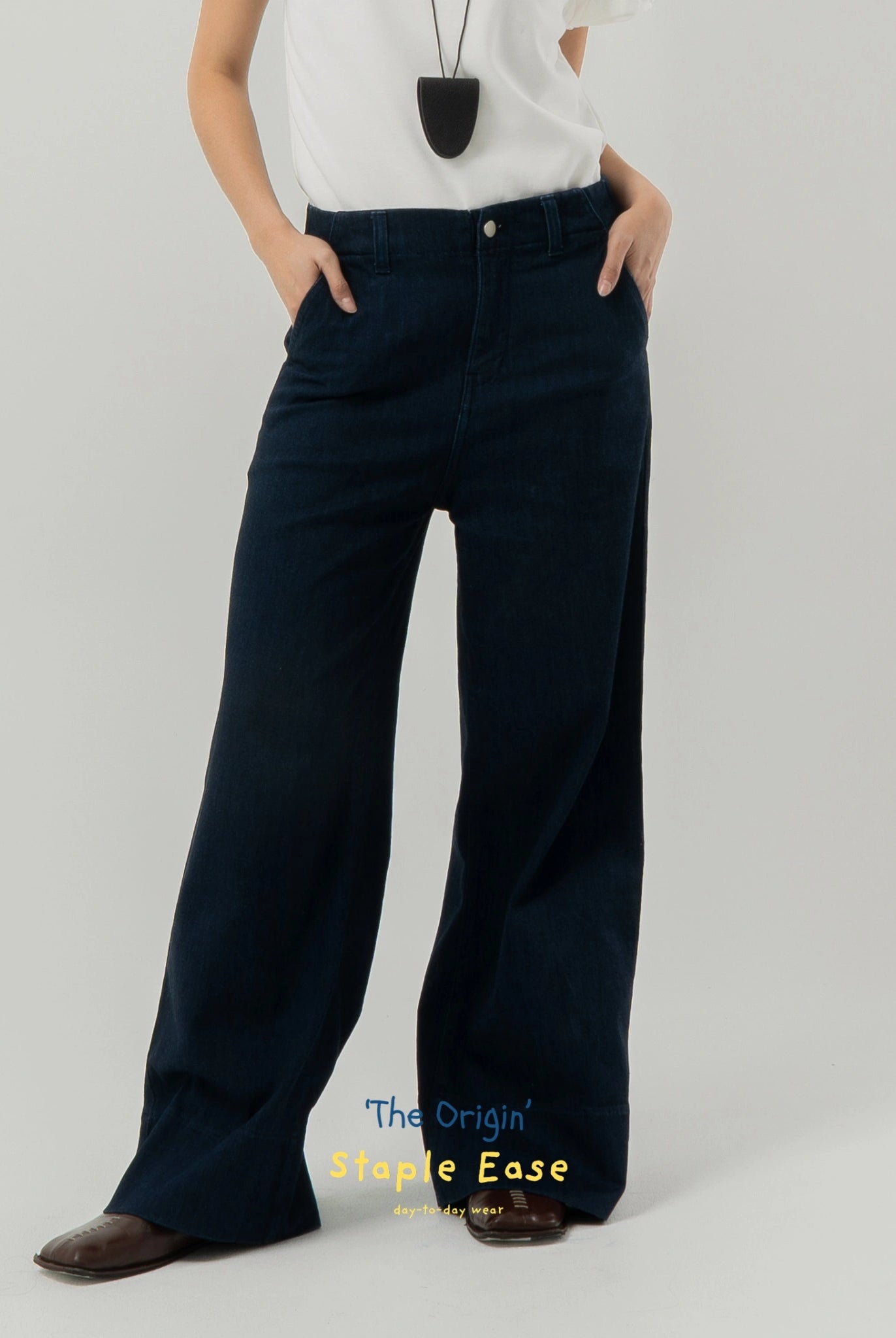 Person wearing navy wide-leg pants by BWBYAZ on a gray background with 'The Origin Staple Ease' text.
Celana denim wanita berwarna biru navy berpotongan lebar dari BWBYAZ yang dikenakan oleh seseorang dengan latar belakang abu-abu.