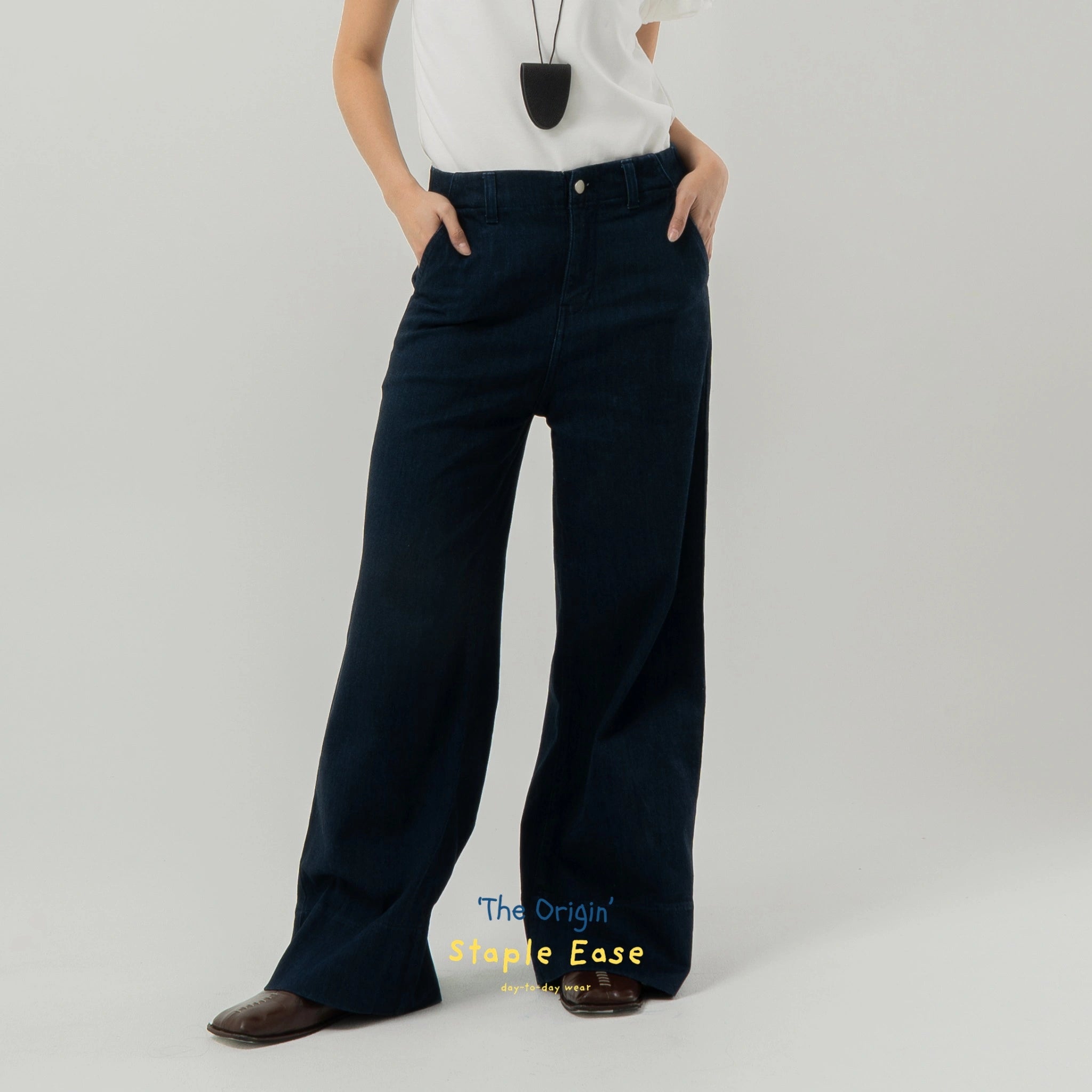 Person wearing navy wide-leg pants by BWBYAZ on a gray background with 'The Origin Staple Ease' text.
Celana denim wanita berwarna biru navy berpotongan lebar dari BWBYAZ yang dikenakan oleh seseorang dengan latar belakang abu-abu.