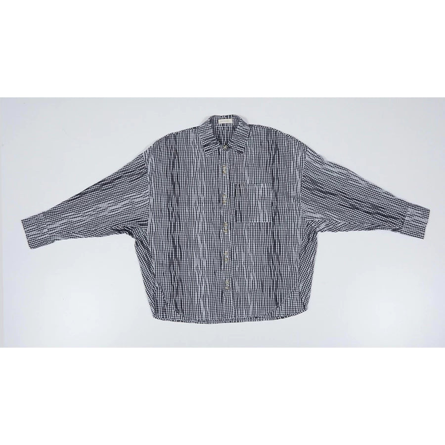 Black and white checkered oversized shirt by Yestoday on a white background