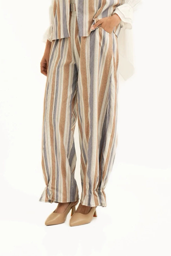 Striped pants by Tunique worn by a person on a white background