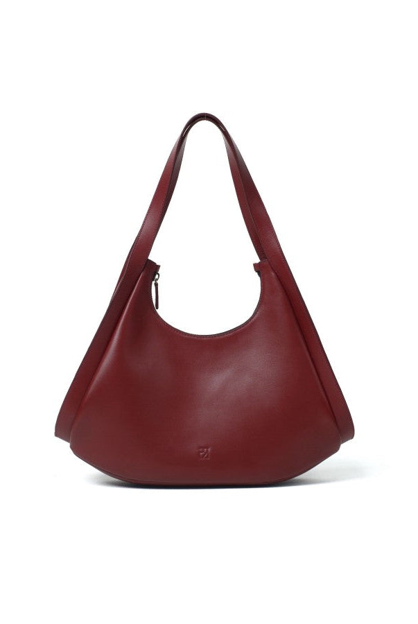 A maroon leather handbag with a zipper closure and a shoulder strap from purotti.