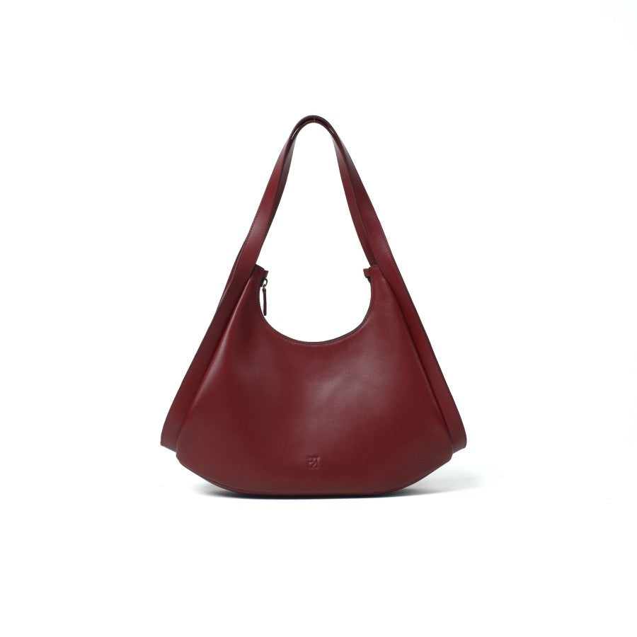 A maroon leather handbag with a zipper closure and a shoulder strap from purotti.