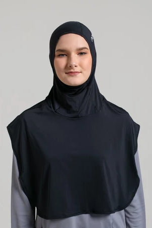 Person wearing a black sport hijab by Noore and gray shirt on a light gray background