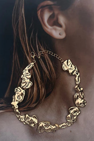 Gold necklace by Darje with unique design