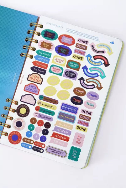 Planner with colorful stickers on a white background