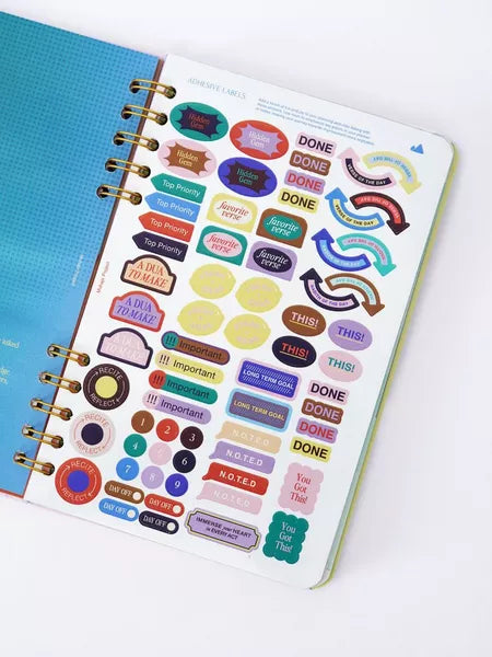 Planner with colorful stickers on a white background