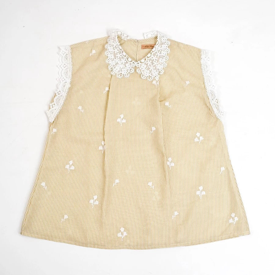 Beige checkered blouse by Holy Peony with white lace collar and sleeves on a white background