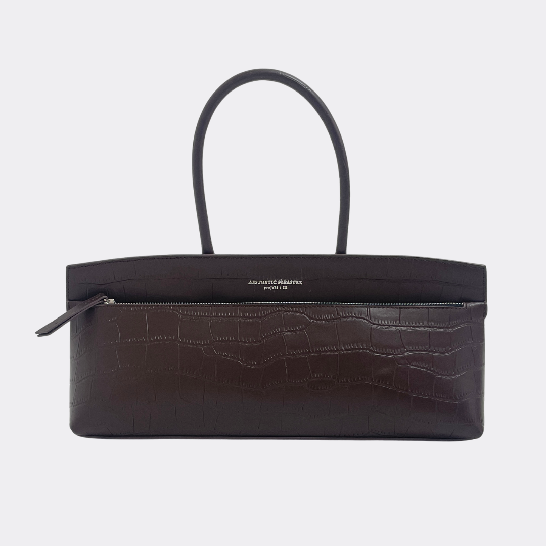 Dark brown baguette handbag with crocodile texture by Aesthetic Pleasure on a white background