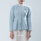 Light blue textured knit cardigan worn by a person on a light gray background, with 'BWBYAZ' branding.