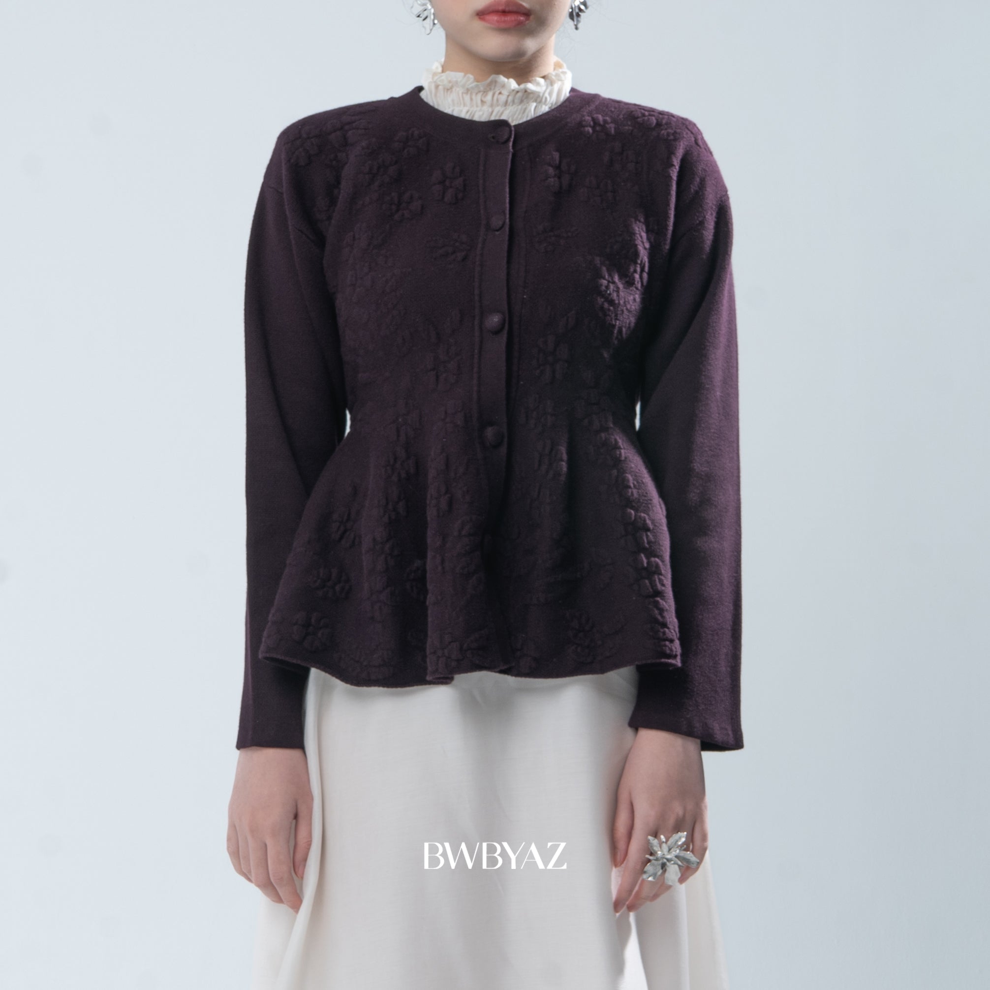Dark purple textured jacket worn by a person on a light gray background, with 'BWBYAZ' branding.
